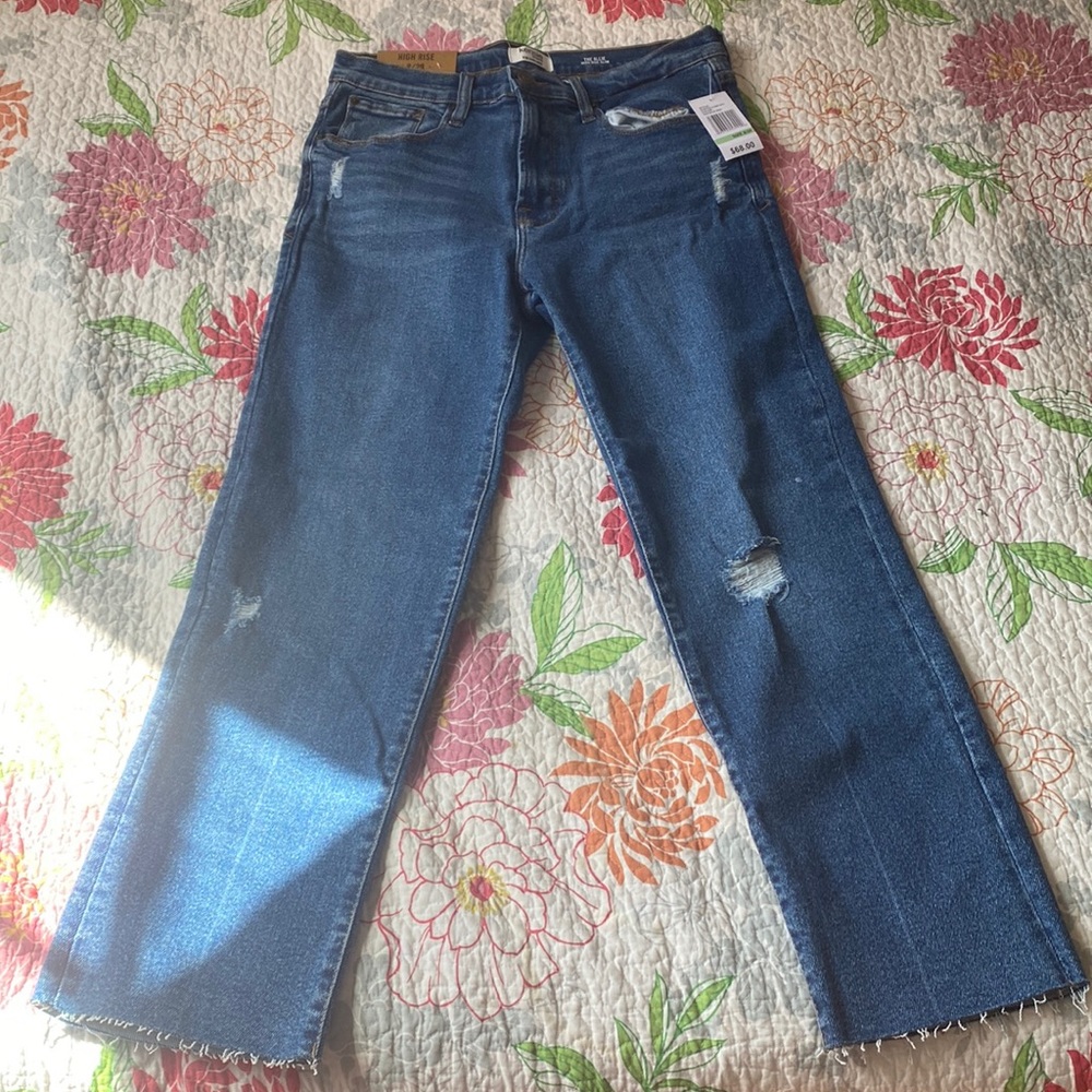 Straight leg skinny jeans slightly distressed look